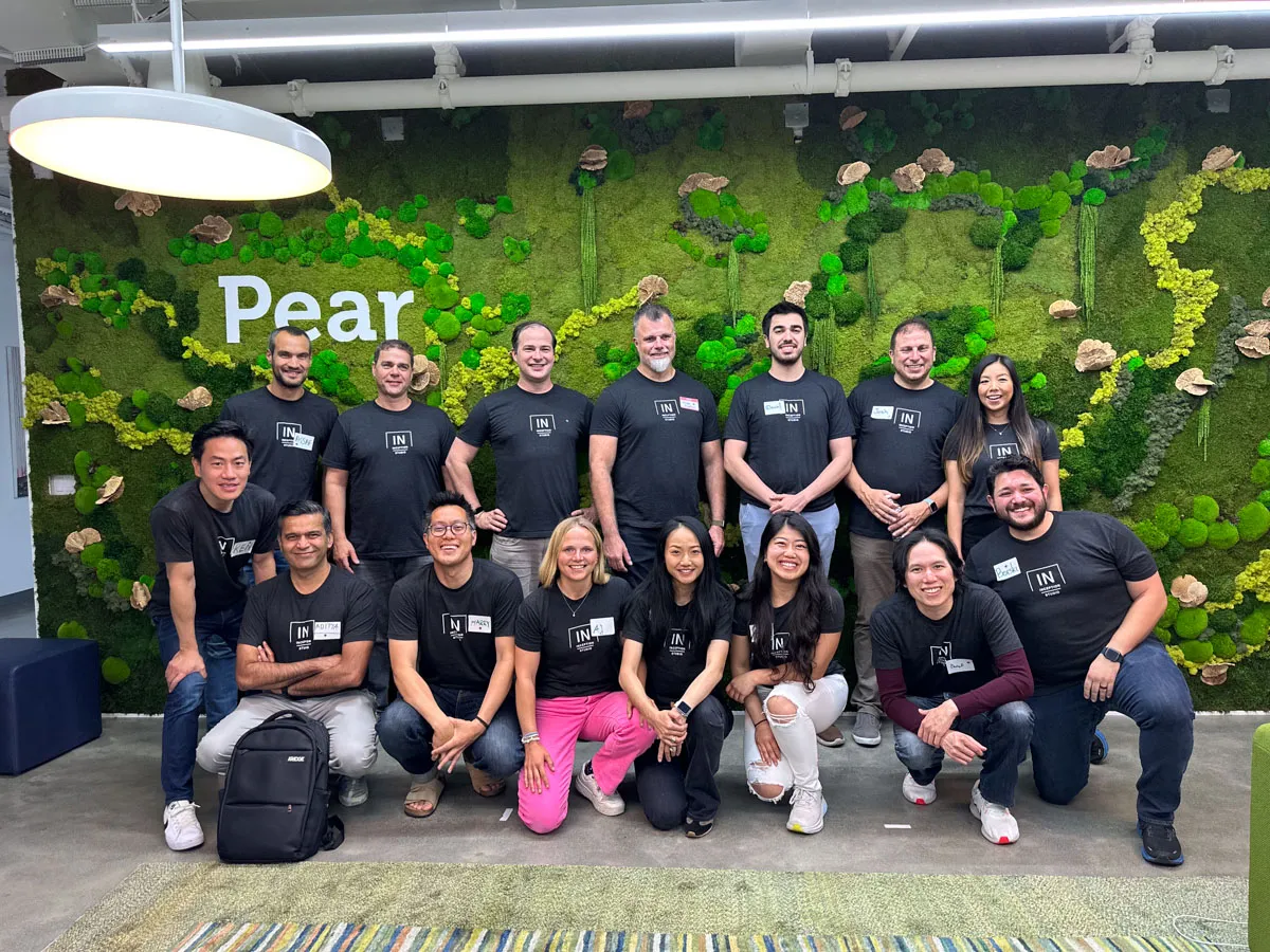 Inception founders standing in front of a moss wall