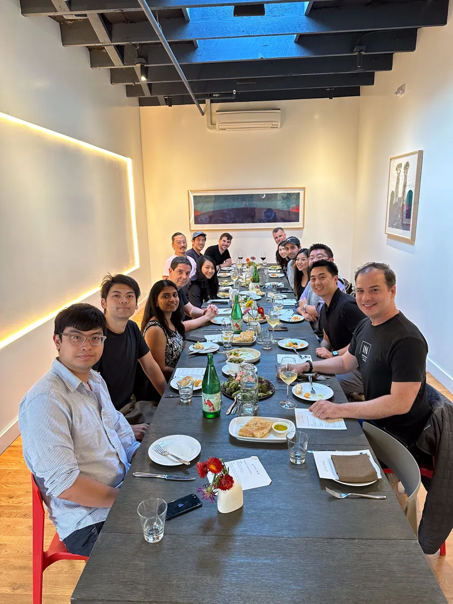 A long table of Inception founders at a fancy dinner event