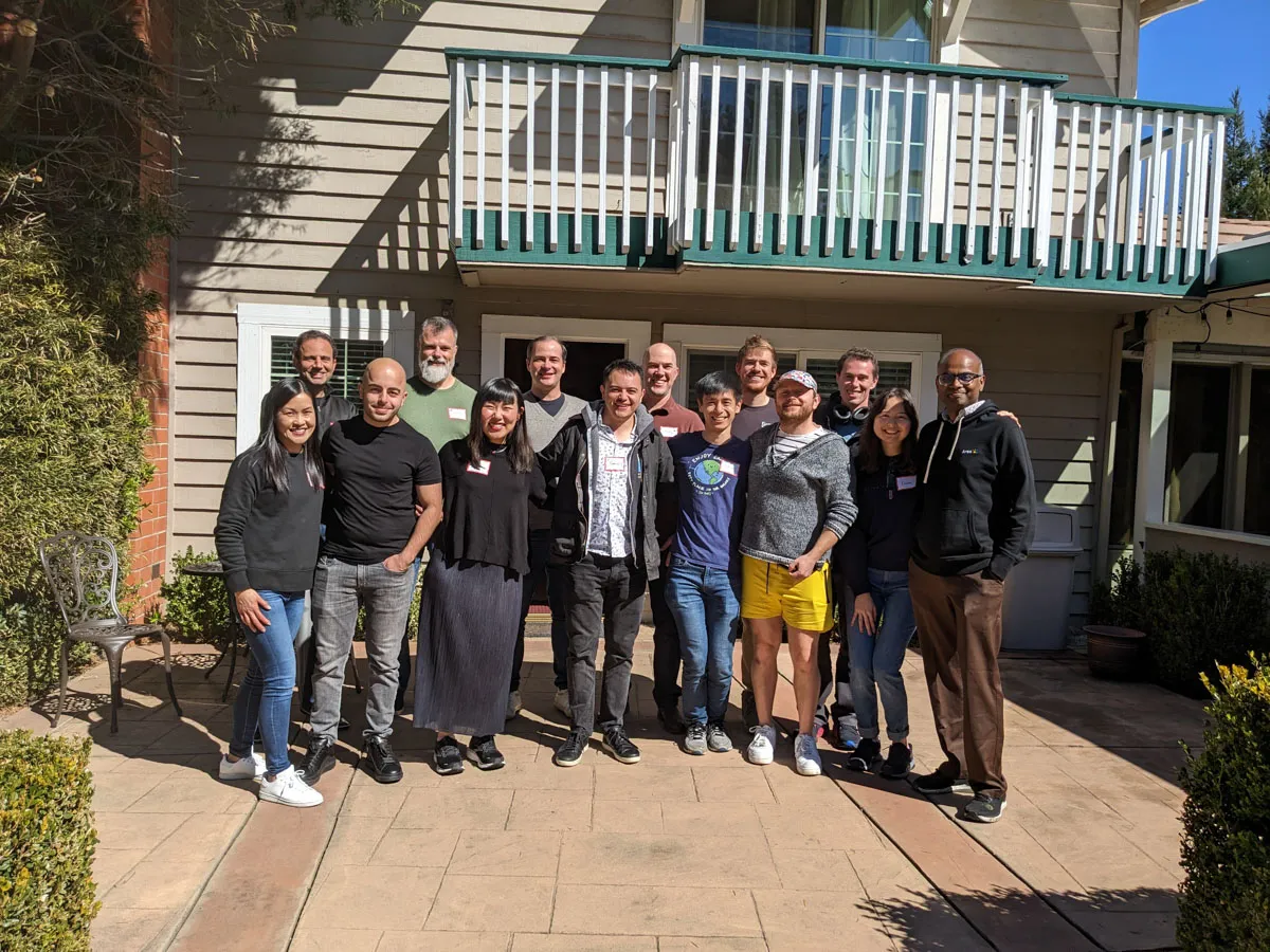 Inception Studio cohort 2 photo of cohort members standing outside a house